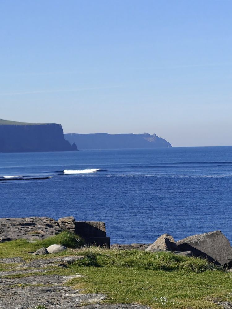 The coastline and cliffs of County Clare on a bright day