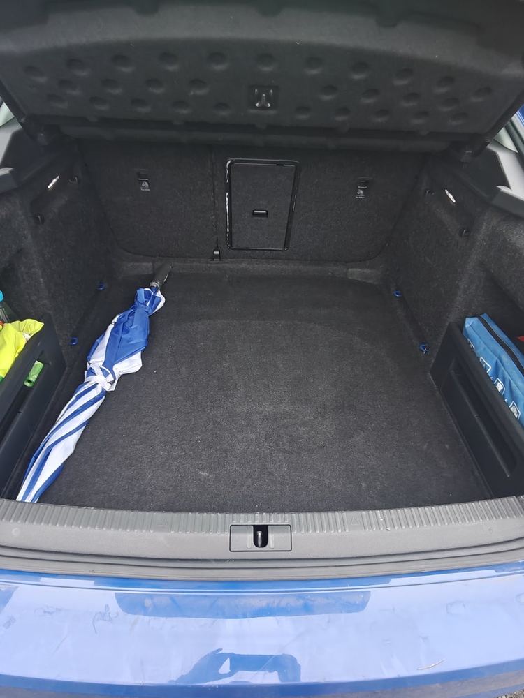 The open, empty boot of Cat's car